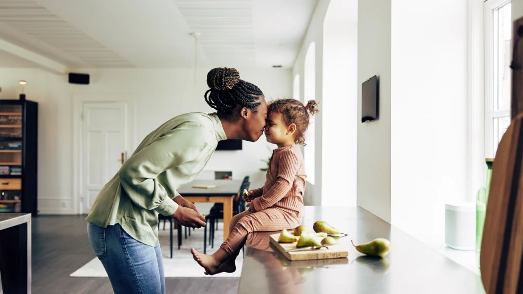 mom and daughter pressing noses together